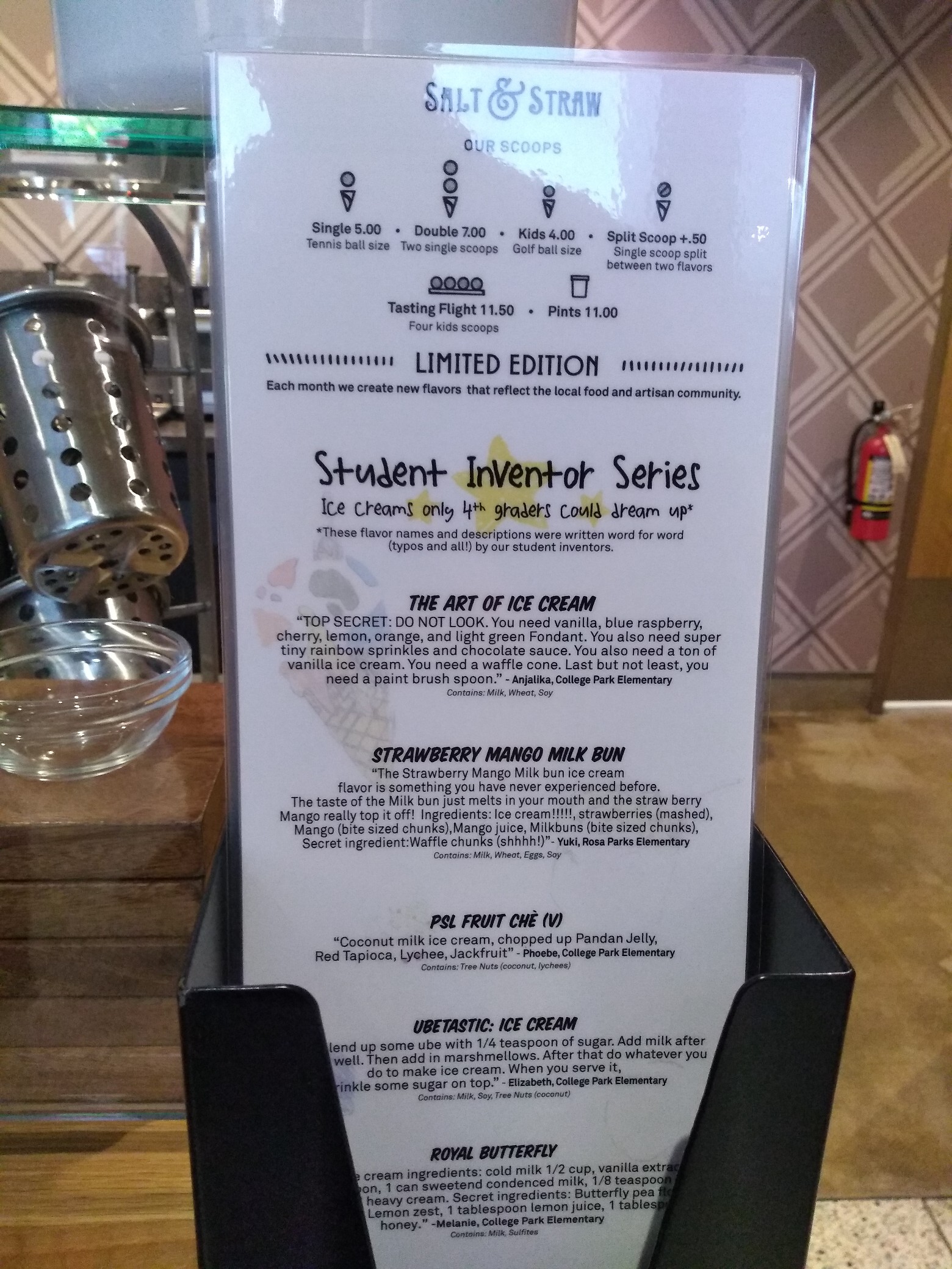 Ice cream parlor menu, featuring the “Student Inventor series—Ice creams only 4th graders could dream up” such as “The art of Ice Cream,” which starts off “TOP SECRET: DO NOT LOOK” and ends “Last but not least, you need a paint brush spoon.”